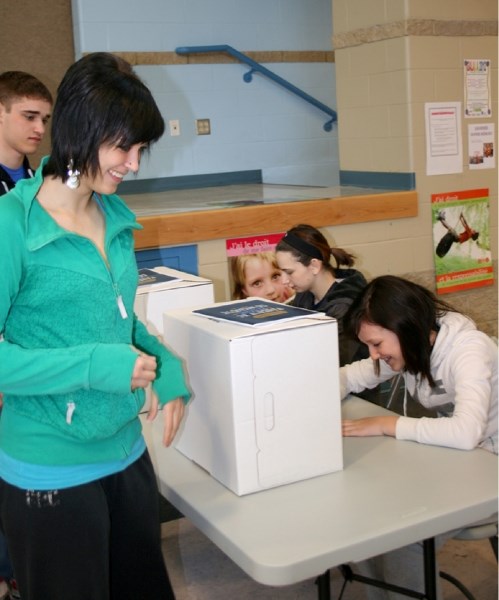 Ashley St. Laurent casts a ballot in the Student Vote mock election at école du Sommet on Thursday, one of 800 schools participating in Student Vote 2012.