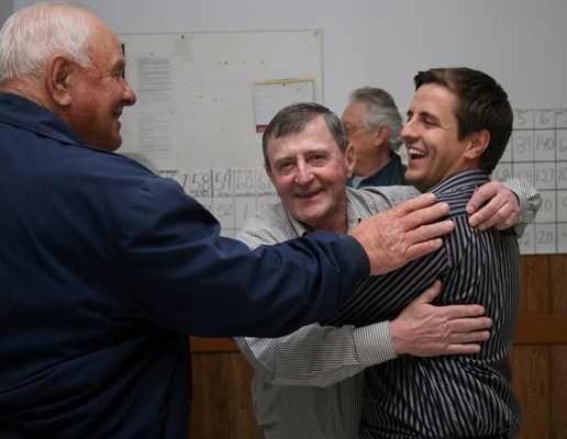 Shayne Saskiw, right, is congratulated by his father Ronnie Saskiw, centre, and other supporters after results confirmed the Wildrose Party won the Lac La Biche &#8211; St.