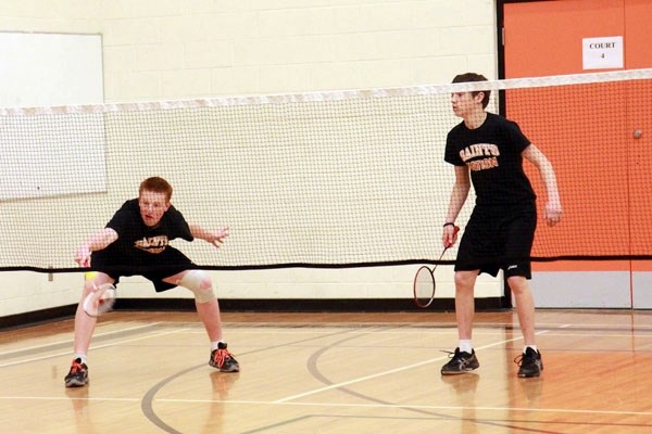 Cy Romanovich (left) attempts a tough shot while partner Draydan Levasseur looks on. The pair finished second in the SPAA badminton junior boys doubles event last Wednesday.