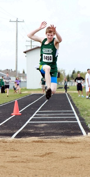 Glendon high school student Colten Zentner competes in the junior triple jump at St. Paul Athletic Association&#8217;s track and field day.