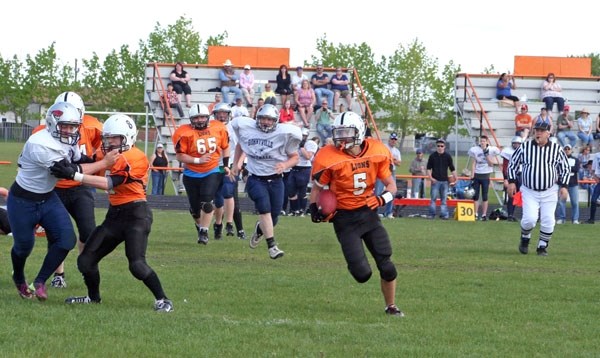 St. Paul&#8217;s Taylor Joly heads for the end zone at the Lions preseason Jamboree, which took place at the field behind Regional High School. A good crowd was on hand to