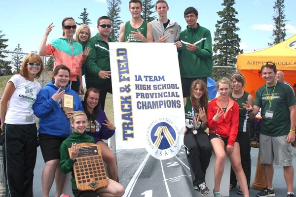 Members from the Glendon track and field team celebrate winning their third provincial track &#038; field banner in a row in Edmonton last weekend.