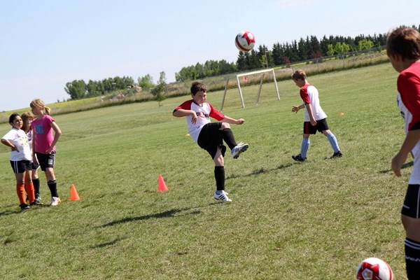 Dawson Lock takes part in a drill at last week&#8217;s British Soccer Camp in St. Paul.