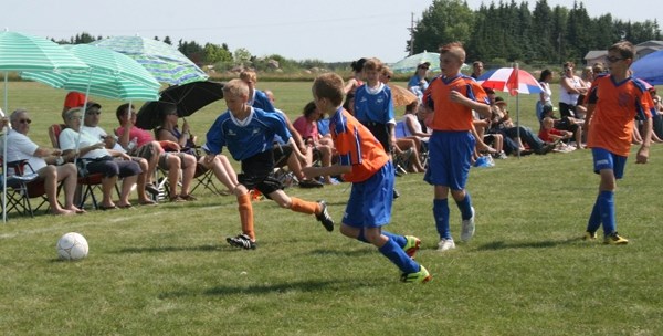 Olivier Lampron chases the ball for St. Paul in the team&#8217;s fourth and final game during provincials this past weekend. St. Paul&#8217;s U12 boys would win that game