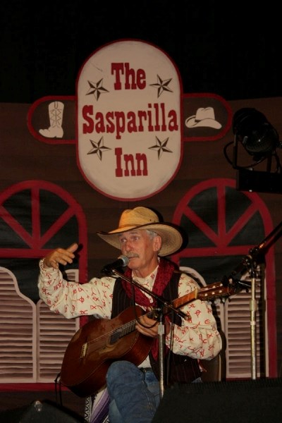 A performer tells stories and sings at last year&#8217;s Vilna Cowboy Fest. The event takes place again this weekend.
