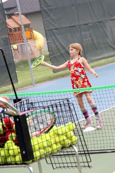Kelli DeMoissac practices her tennis skills at a regular tennis practice last week.
