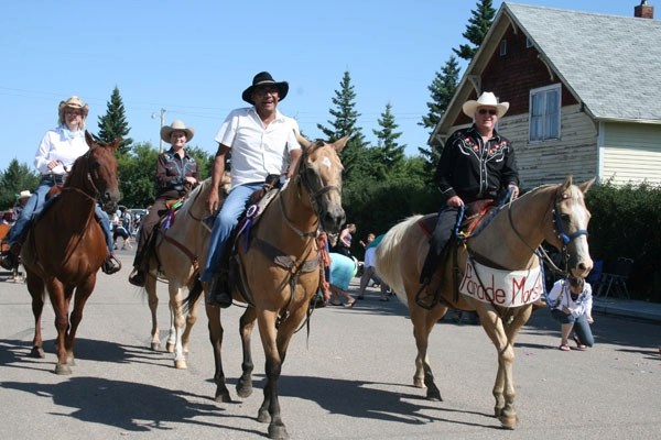 Horses and their gallant riders make their way down Ashmont&#8217;s main street during the Heritage Days&#8217; parade last Saturday morning.