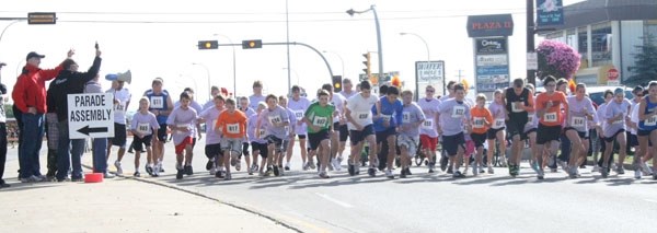 Participants in last year&#8217;s annual Rodeo Mile take off at the start line of the race. The Rodeo Mile will once again take place through downton St. Paul on Sept. 1,