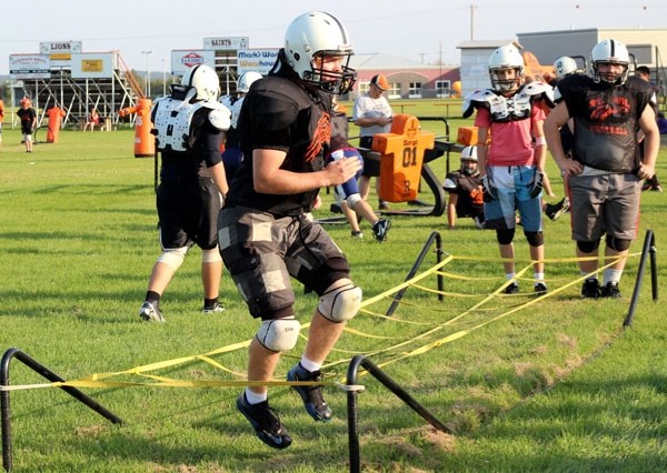 The Lions work on conditioning at a practice last week.