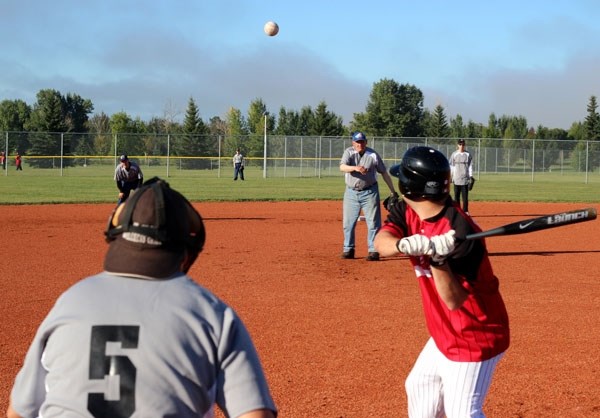 Amil Kochkur of the St. Paul blue division team pitches the ball to a batter from Camrose during the Conrad Jean Special Olympics Slo- Pitch Tournament on Sunday.