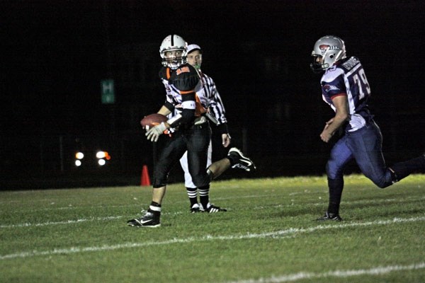 Lions quarterback Brenden McKay looks for an open man in the team&#8217;s fourth straight victory, winning 50-20 over the Bonnyville Voyageurs on Friday night.