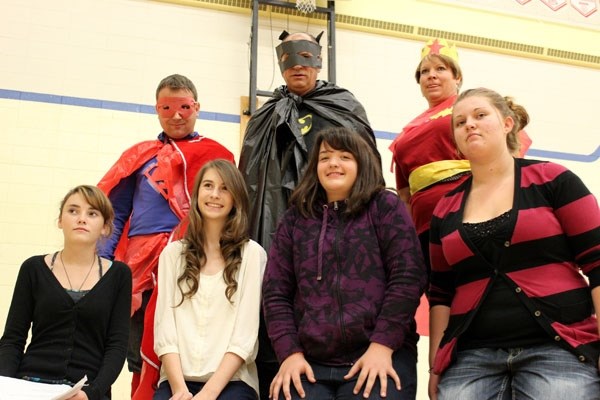 Ecole Mallaig School Grade 9 students (bottom, from left) Cassandra Bodnar, Allison Christensen, Natalie Lefebvre and Autumn Amero helped raise $1,709.77 at this year&#8217;s 