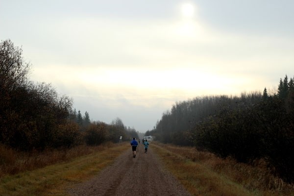 Runners near the end of the first leg of the Iron Horse Ultra 100 on Satruday morning near St. Edouard. The race saw 78 runners complete either the 100 kilometre or 100 mile