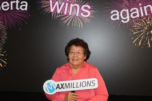 Eleanor Steinhauer-Halfe happily accepts her one million dollar Lotto Max winnings last week.