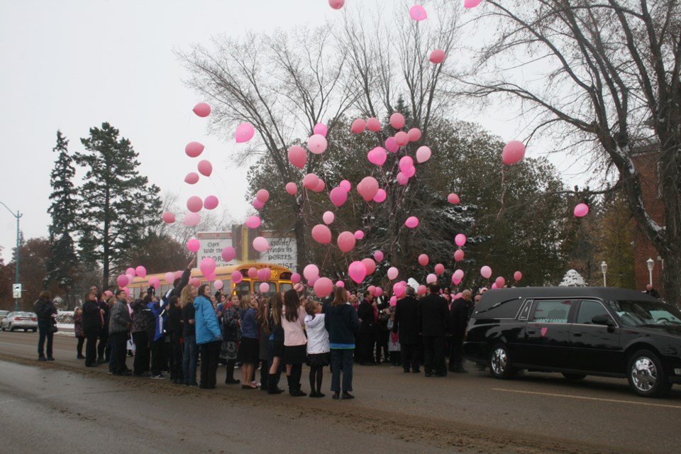 Racette School students released balloons in the air as they joined in the emotional farewell for 11-year-old Megan Wolitski at her funeral this past Saturday