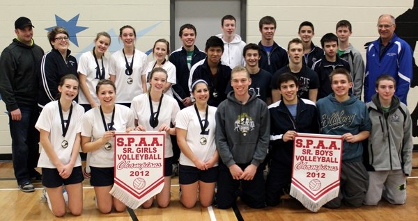 école Mallaig School&#8217;s senior boys and girls volleyball teams pose with their championship banner after both teams took down St. Paul Regional High School in the SPAA