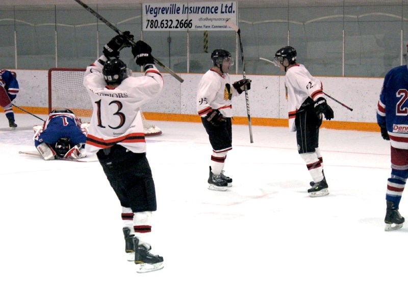 Dallas Desjarlais, Corbert Mastoosh and Dillan Alexis celebrate Alexis&#8217; Game 7 overtime winner while the Vegreville Rangers hang their heads.