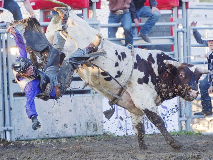Dace Chisan is tossed from the back of a bull at a 2012 rodeo in St. Albert