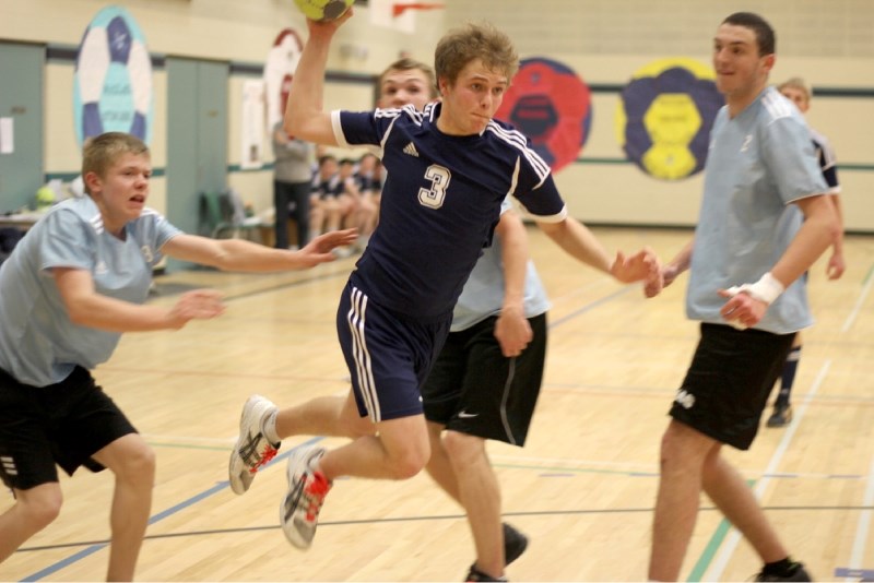 Jeff Hatch storms through a pair of Master&#8217;s College defenders as seconds tick off the clock, firing the semifinal game-winning goal into the back of the net to life