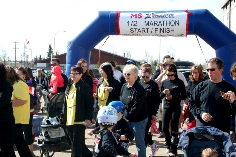 Participants in the Enerflex MS Walk begin at the starting line in front of the Rec. Centre.