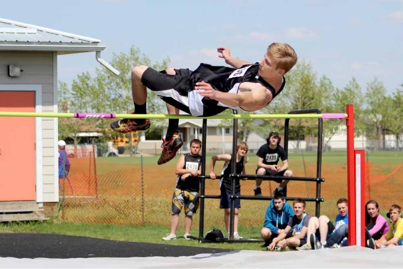 Jonathan Krankowski soars through the air for the boys intermediate high jump event at St. Paul Atheltics Association track and field finals on May 22. Krankowski finished