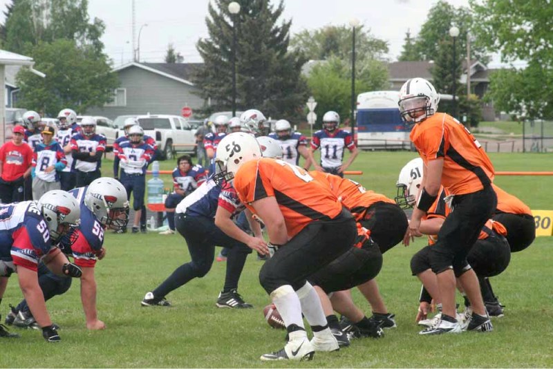 Lions quarterback Brenden McKay prepares to call for the snap during a jamboree football game against the Bonnyville Voyaguers on Saturday.