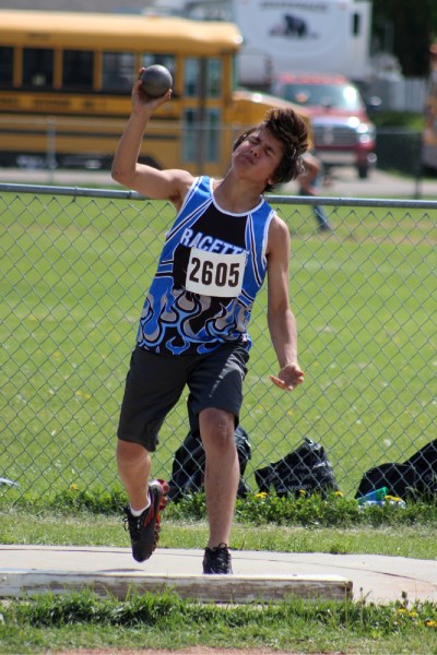 Isaac Porozni launches a shot put with a hard throw at the St. Paul Athletic Association junior track and field finals at St. Paul Regional last Tuesday.