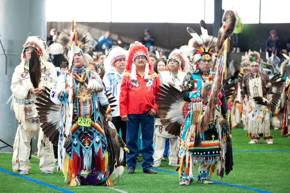 Newly elected Saddle Lake Chief Leonard Jackson (in red) takes part in the Friday night grand entry at the annual Saddle Lake Cree Nation Powwow.
