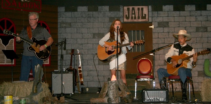 Bob Glidden, Kayla Patrick, and Jackson MacKenzie perform together at the 3rd annual Cowboy Fest, held at Vilna Cultural Centre on July 20.