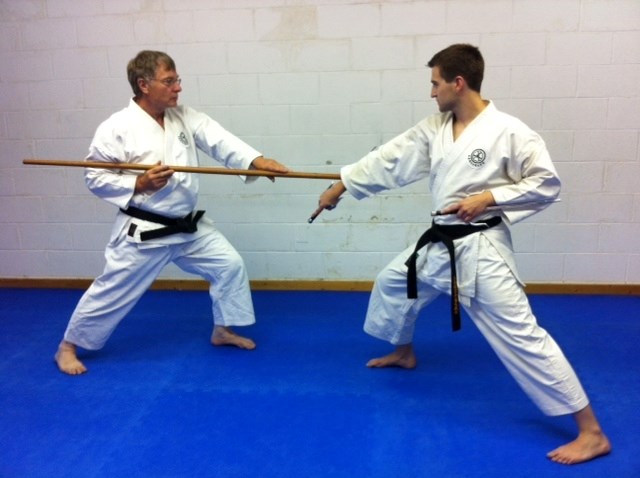 Calvin Leckie and Ryan Poitras, seen here using a Bo and a Sai, respectively, were recently among the first Canadians to receive black belts in Kobudo.
