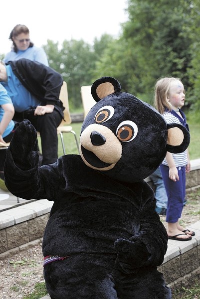 A friendly bear was on hand to offer hugs and dance moves at the Bears and Berries festival at Fort George and Buckingham House on July 20.