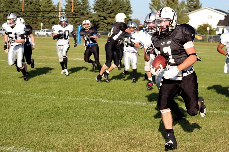 Running back Jason Jubinville storms downfield as a member of the St. Paul Lions last year. Jubinville now plays in the Canadian Junior Football League with the Edmonton