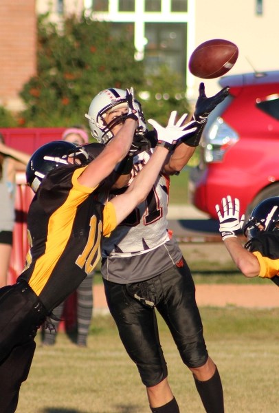 Cold Lake Royals defensive back Justin Hodinsky steals a pass out of the hands of St. Paul Lions wide receiver Darrell Stranger in the Lions 32-25 loss on Friday.