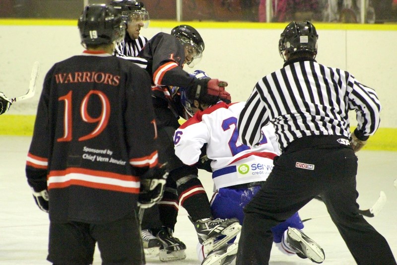Saddle Lake Warrior Dallas Steinhauer and St. Paul Canadien Marshall Derocher engage in a scuffle in the Warriors 11-3 victory on Saturday evening.
