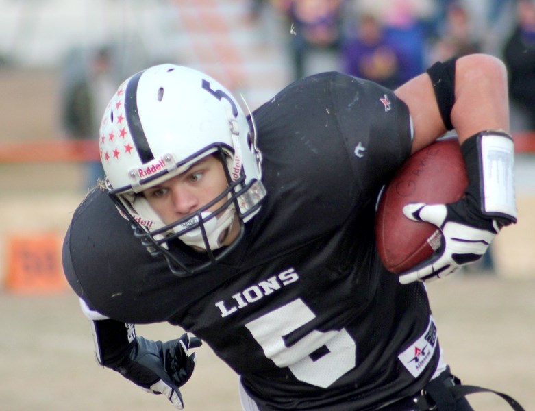 Lions&#8217; running back Taylor Joly jukes with the ball in his team&#8217;s 22-0 victory over the Lloydminster Barons in Saturday&#8217;s Wheatland Football League