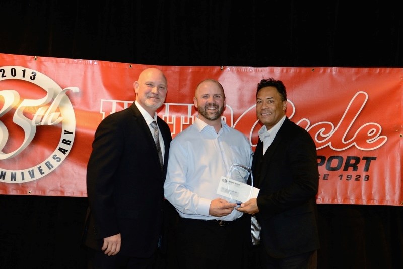 St. Paul Minor Ball President Rick Austin (middle) receives the Baseball Alberta Small Association of the Year Award from former Toronto Blue Jays Duane Ward (left) and