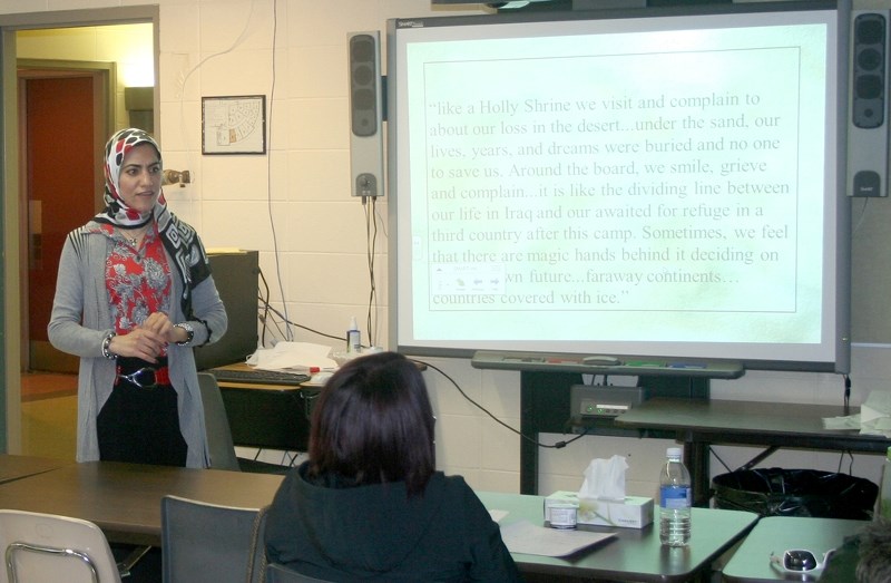 Dilja Al-Rekabi, a social justice and human rights advocate speaks with students in the Social Work Diploma Porgram at Blue Quills First Nations College, on Nov. 26.