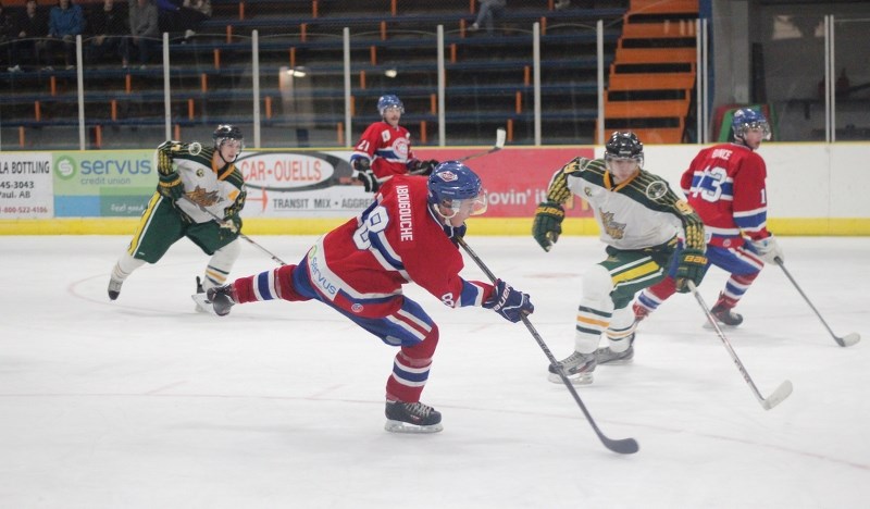 St. Paul Canadiens leading scorer Jalel Abougouche fires the game-winning shot into the net on a power play in double overtime to lift his team to a 4-3 victory over the