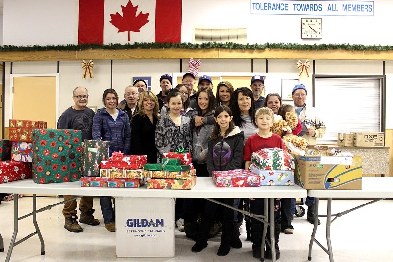 Volunteers from the Knights of Columbus Christmas Hampers program and the Santa&#8217;s Elves program celebrated a succuessful holiday season on Dec. 22 at the St. Paul