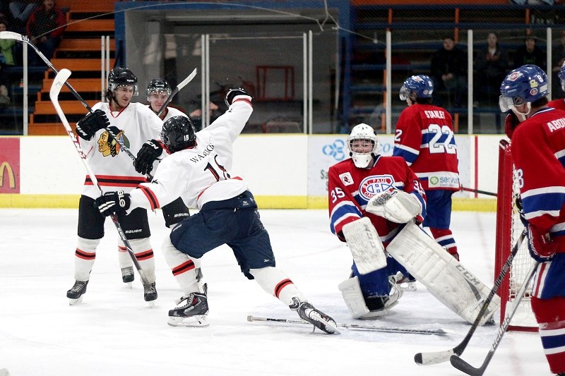 Saddle Lake Warrior Tyler Haineault celebrates one of four goals scored en route to a 7-4 Warriors victory over the St. Paul Canadiens at Clancy Richard Arena on Dec. 20.