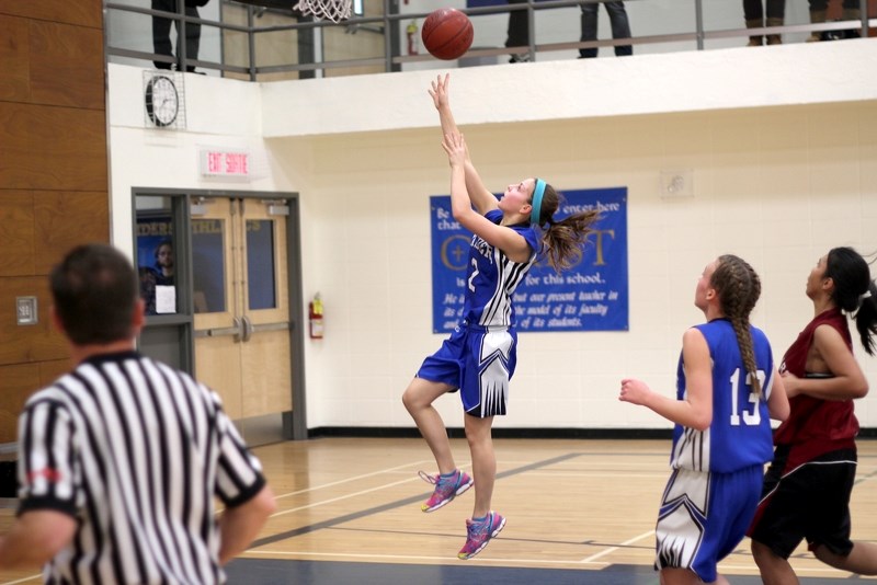 Racette Raider Amy Bespalko charges in for a lay up during her team&#8217;s 39-32 finals victory over the Holy Rosary Raiders at Hoops 4 Cancer, held at Racette this weekend.