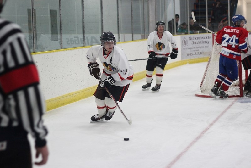 Saddle Lake Warriors defenceman Silas Makokis carries the puck out of his own zone during a game against the St. Paul Canadiens earlier this season.