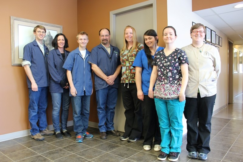 Dr. Craig Hellquist (fourth from left), seen here standing alongside his team at the St. Paul Veterinary Clinic, was recently honoured with the title of Veterinarian of the