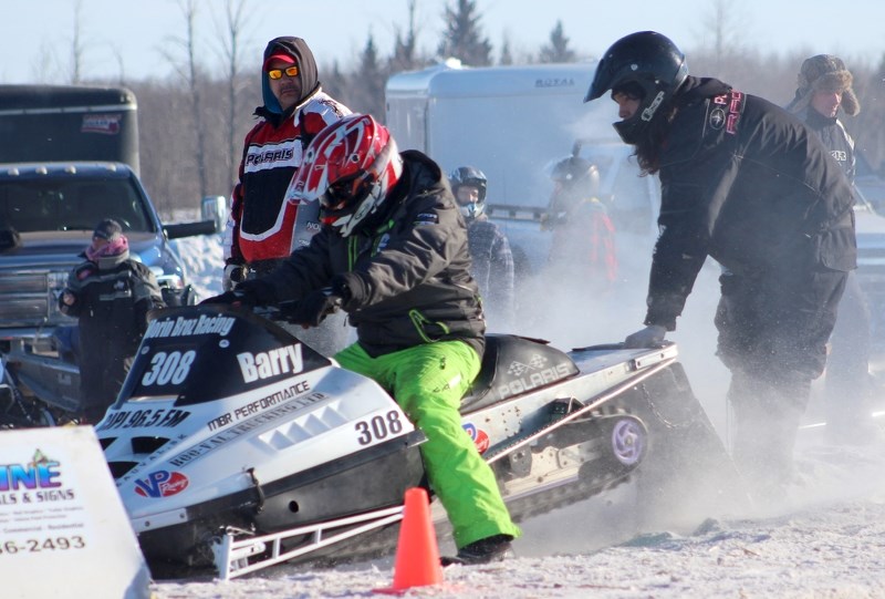 Barry Morin Jr. prepares for a drag race at the Choko Pro Racing Series snowmobile drag races, hosted by the St. Paul Trailblazers just east of town on Feb. 8.