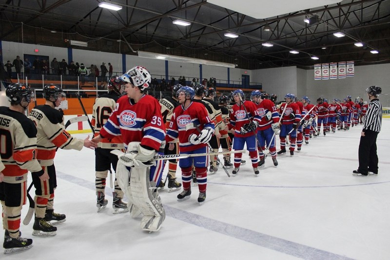 The St. Paul Canadiens shake hands with the Wainwright Bisons after losing a best of seven series 4-0 in the NEAJBHL playoffs, with a 3-1 loss in Game 4 on Friday night at
