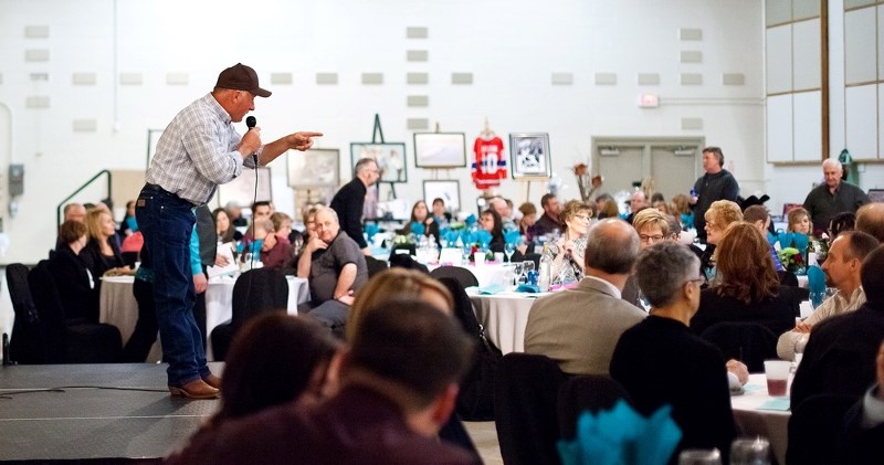 Auctioneer Andy Jubinville brings in bids during the live auction portion of the St. Paul &#038; Disctrict Hospital Foundation fundraiser on Saturday night at the Rec. Centre.