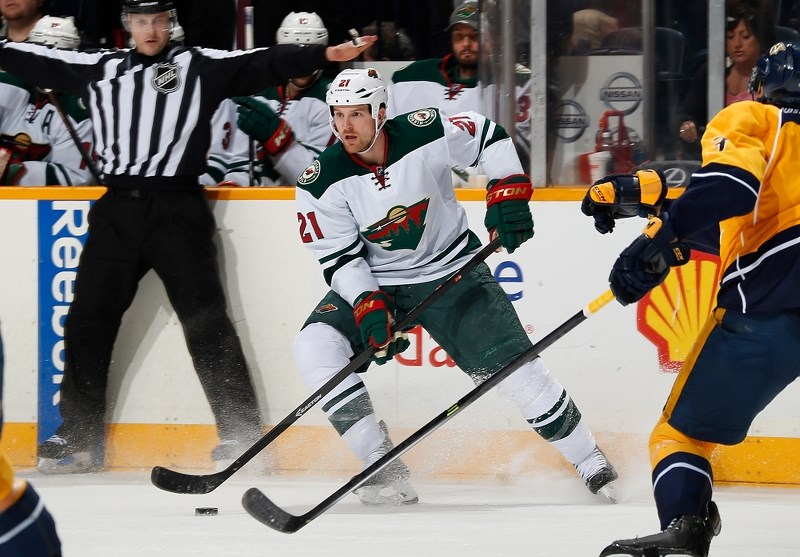 St. Paul born Kyle Brodziak stops with the puck during a regular season match up against the Nashville Predators.