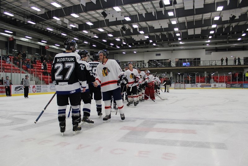 The Saddle Lake Warriors, led by Silas Makokis, shake hands with the Cold Lake Ice after being eliminated from the post season with an 8-4 loss in Game 5 on Friday in Cold