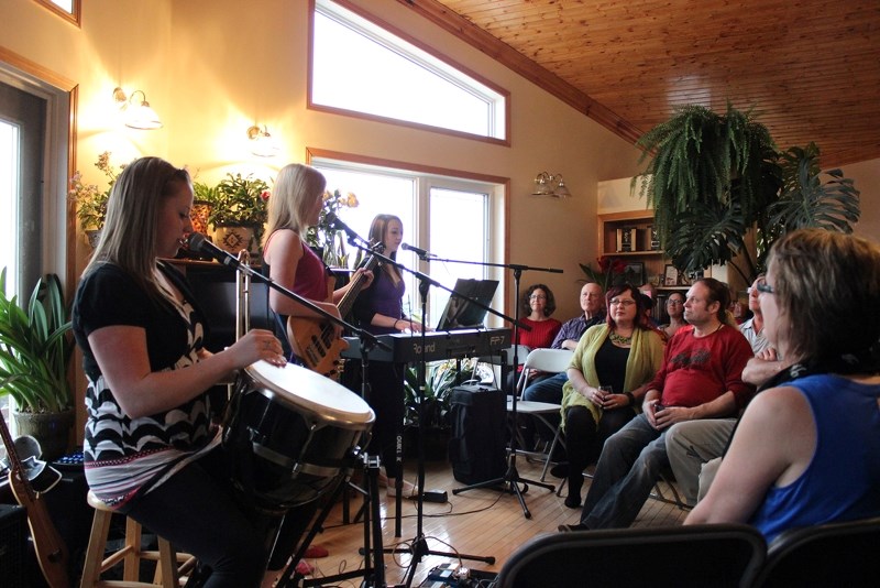(From left) Danica Chrapko, Chloe Corbiere and Elise Lamoureux entertain the audience with an opening performance at a Home Routes concert at Wayne and Wendy Kreoski&#8217;s
