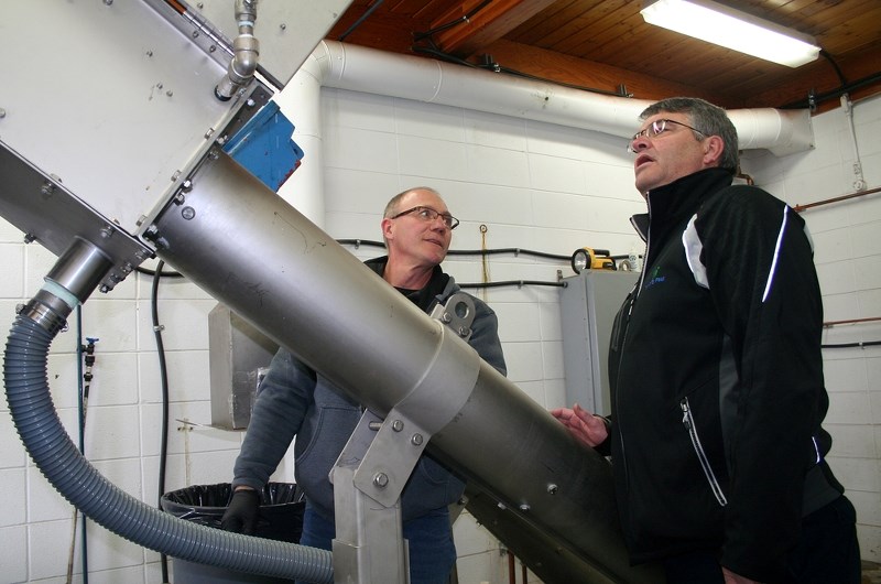 Bert Pruneau, chief plant operator at the St. Paul Pollution Control Centre shows Coun. Don Padlesky the new screening unit that was purchased with funds from the Gas Tax